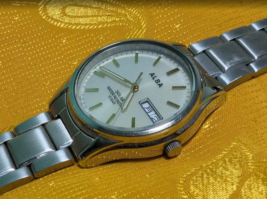 Vintage Pre-Owned Seiko Alba V158-0AX0 Solar Watch 37mm Silver Dial Day Date Stainless Steel Japan Working