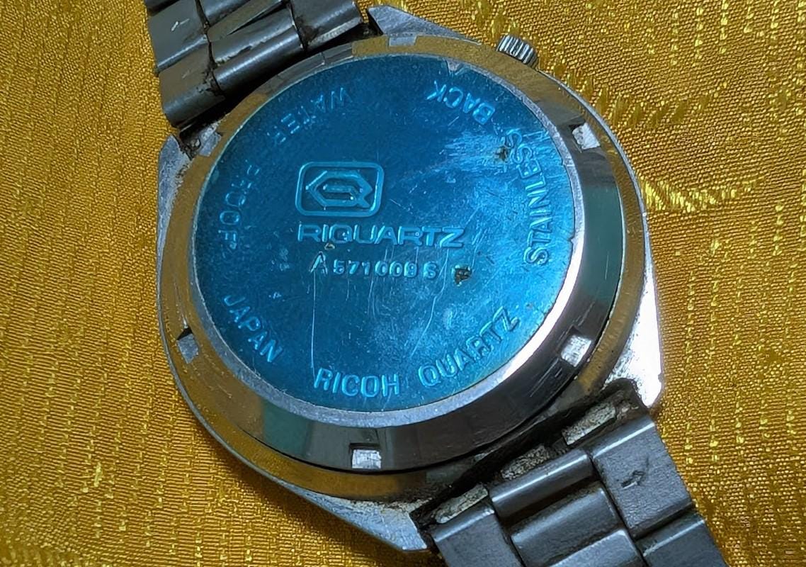 Rare Vintage Pre-Owned Ricoh Riquartz Tiger Eye Dial Japan Watch 38mm Day Date Quartz Steel Bracelet Working Condition