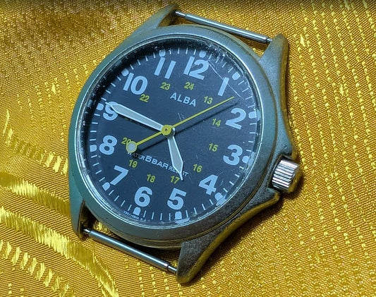 Vintage Pre-Owned ALBA V501-0AK0 Field Style Quartz Watch 37mm Military Dial New Battery Working Japan Movement.