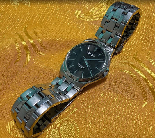 Vintage Pre-Owned Seiko 7N01-0DM0 Minimalist Black Dial Watch 35mm Slim Stainless Steel Quartz Working Japan