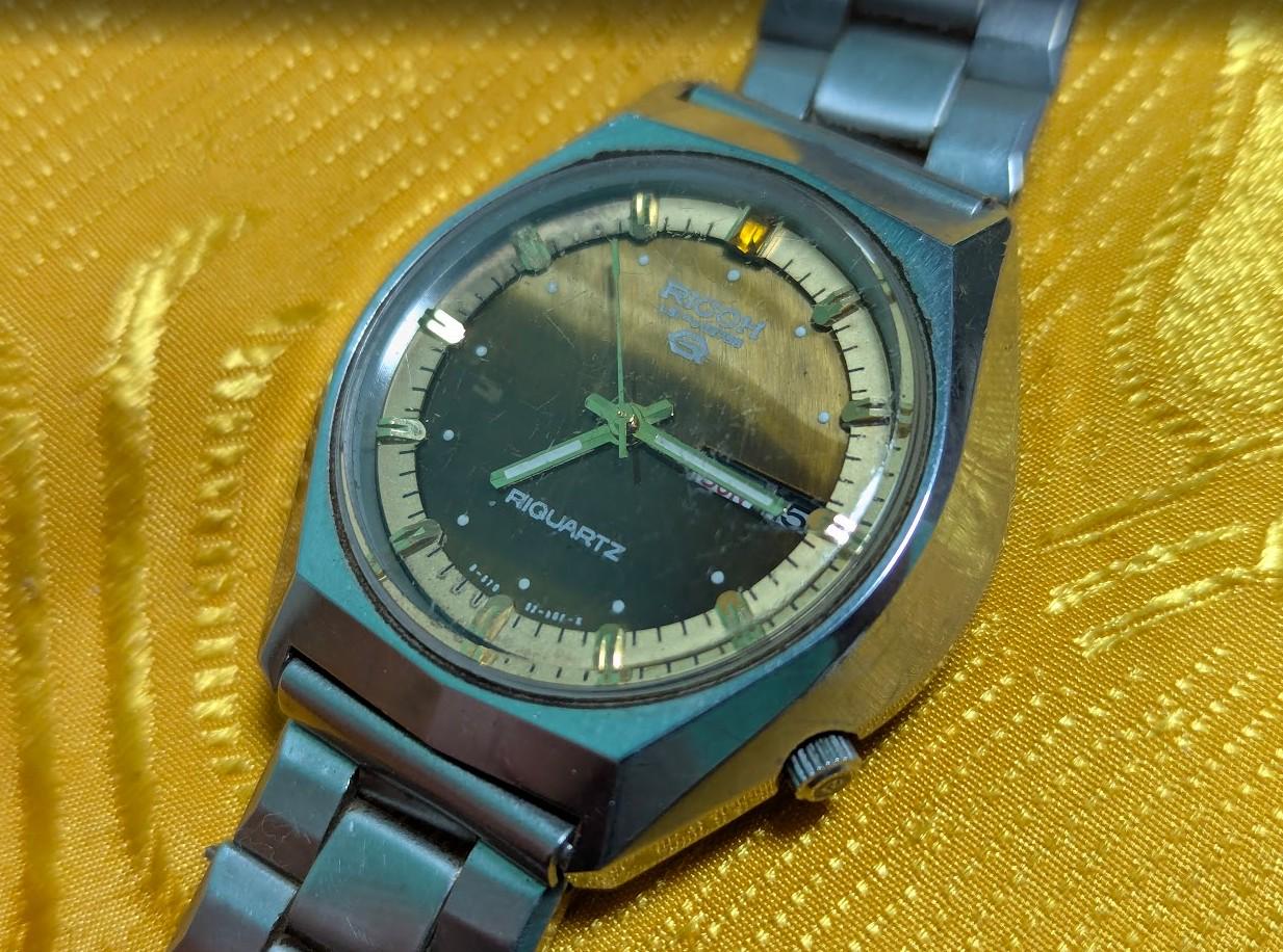 Rare Vintage Pre-Owned Ricoh Riquartz Tiger Eye Dial Japan Watch 38mm Day Date Quartz Steel Bracelet Working Condition