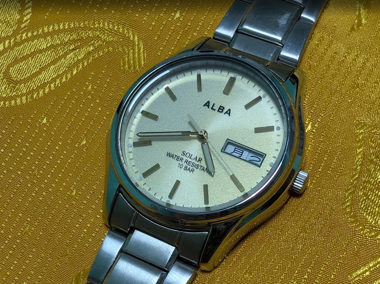 Vintage Pre-Owned Seiko Alba V158-0AX0 Solar Watch 37mm Silver Dial Day Date Stainless Steel Japan Working