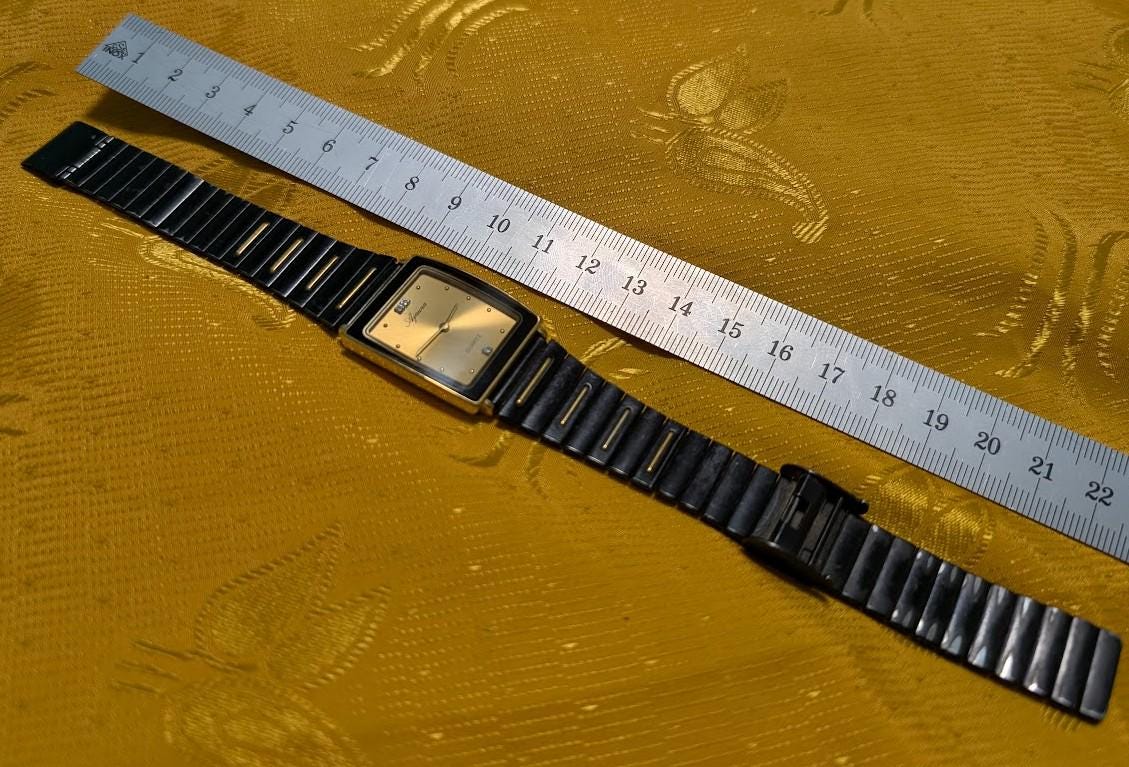 Ajawra Quartz Vintage Pre-Owned Watch A-101M Rectangular Gold Dial Classic Design .case 25mm.New battery
