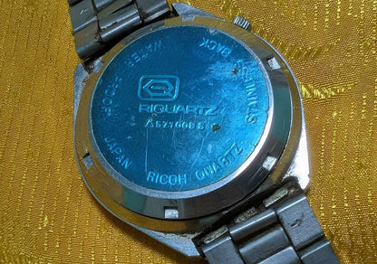 Rare Vintage Pre-Owned Ricoh Riquartz Tiger Eye Dial Japan Watch 38mm Day Date Quartz Steel Bracelet Working Condition