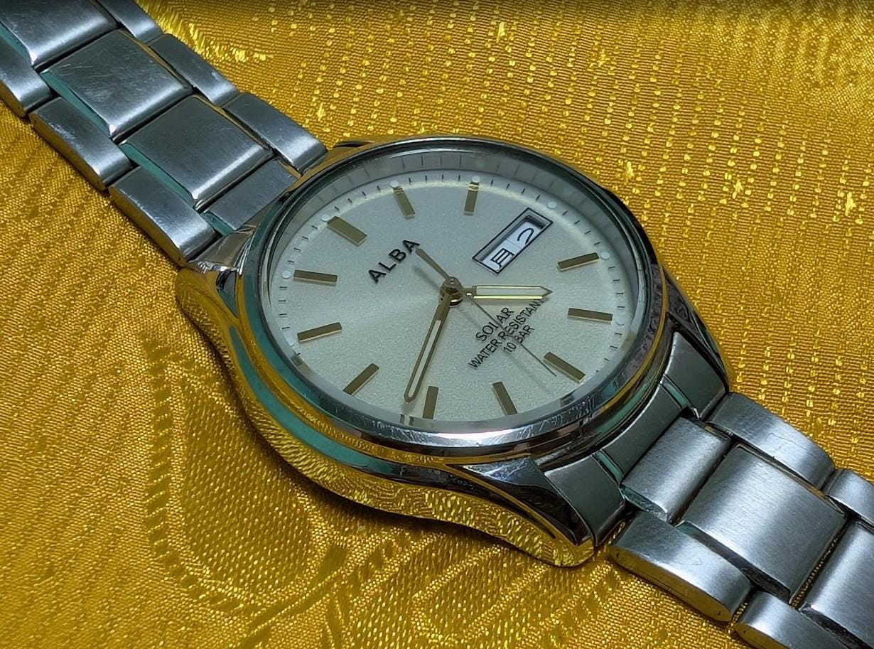 Vintage Pre-Owned Seiko Alba V158-0AX0 Solar Watch 37mm Silver Dial Day Date Stainless Steel Japan Working