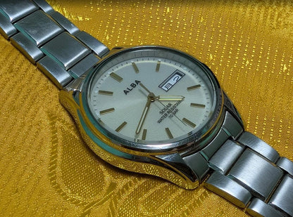 Vintage Pre-Owned Seiko Alba V158-0AX0 Solar Watch 37mm Silver Dial Day Date Stainless Steel Japan Working