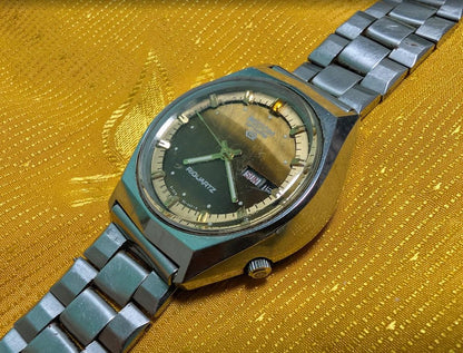 Rare Vintage Pre-Owned Ricoh Riquartz Tiger Eye Dial Japan Watch 38mm Day Date Quartz Steel Bracelet Working Condition
