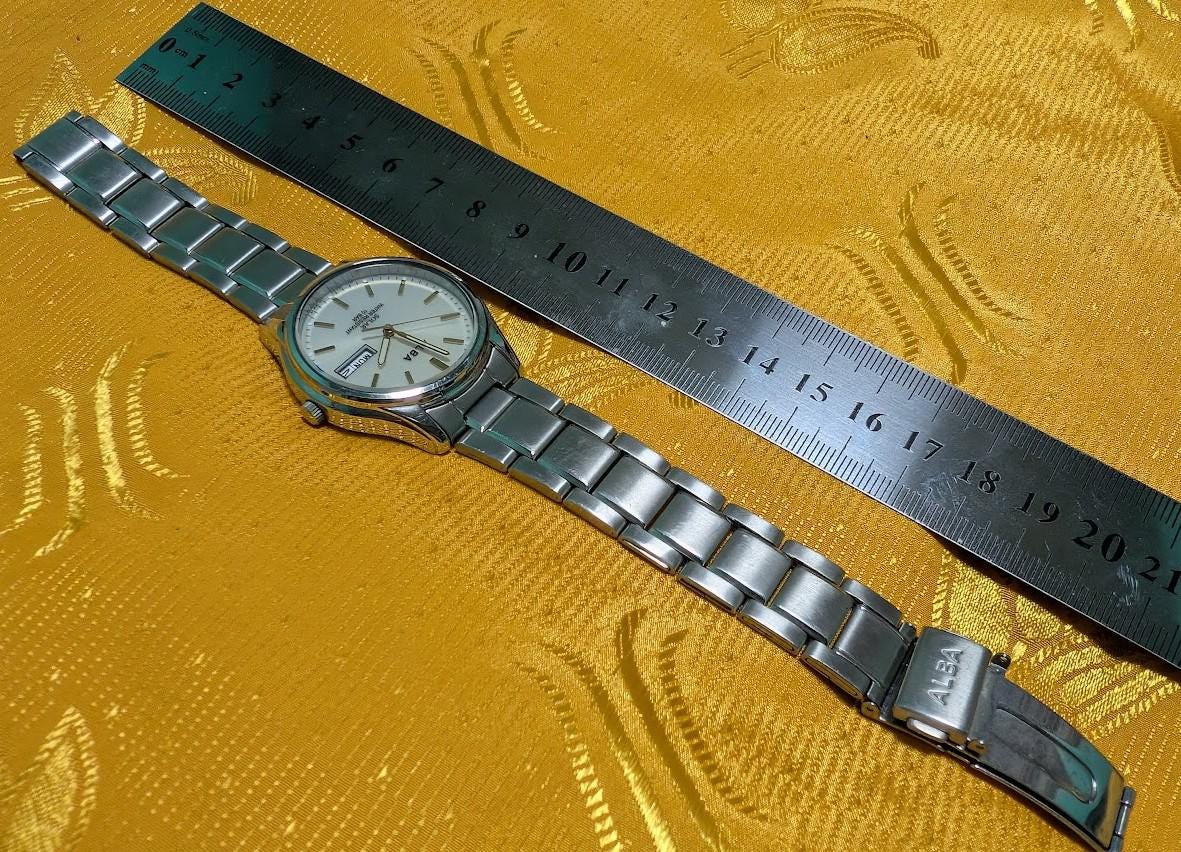 Vintage Pre-Owned Seiko Alba V158-0AX0 Solar Watch 37mm Silver Dial Day Date Stainless Steel Japan Working