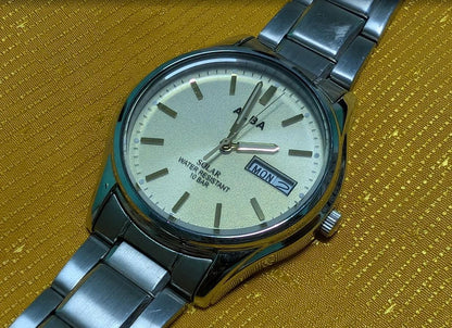 Vintage Pre-Owned Seiko Alba V158-0AX0 Solar Watch 37mm Silver Dial Day Date Stainless Steel Japan Working
