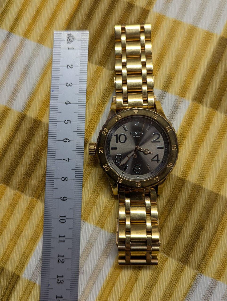 Pre-Owned Nixon The 38-20 Gold Tone Stainless Steel Watch 200M Women’s – Not Working – For Repair